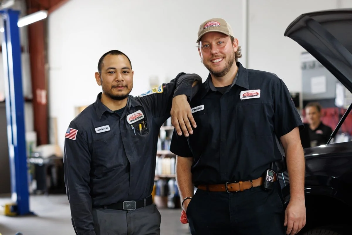 Two Harrell’s automotive technicians standing together in the shop
